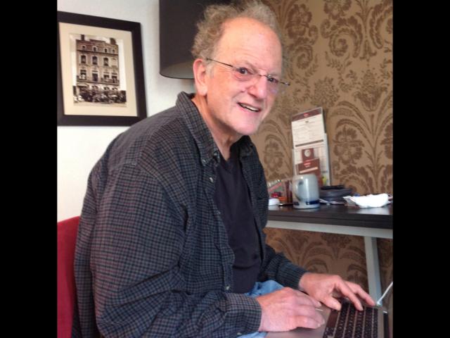 Charles Bazerman working on his computer. Courtesy Photo.