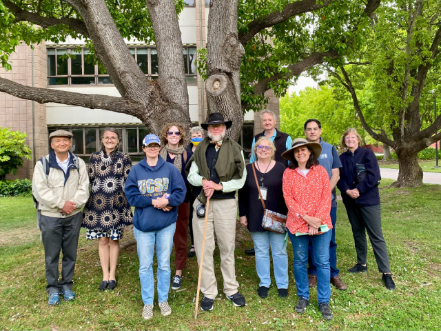 Bruce H. Tiffney (in the middle with his walking stick) and friends and family of Jo Little at the 2023 Jo Little Memorial Campus Walk on May 22.