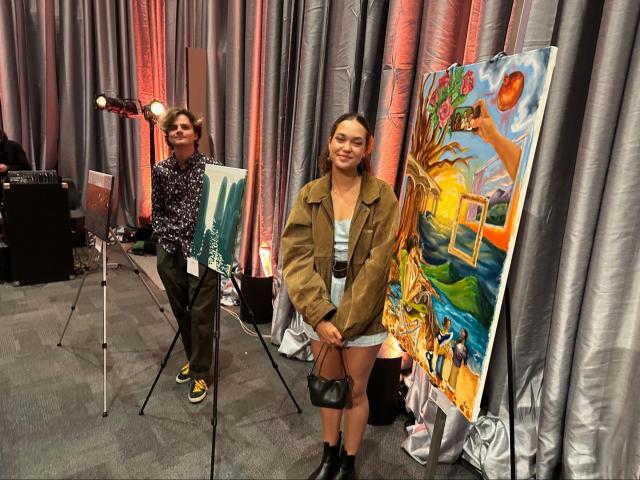 L to R: Owen Jenkins '24 (CCS Art) and Bahia Washington ’26 (CCS Art) with their paintings