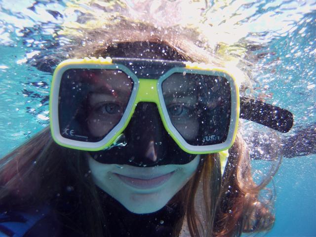 Christin snorkeling around the Great Barrier Reef in Australia.