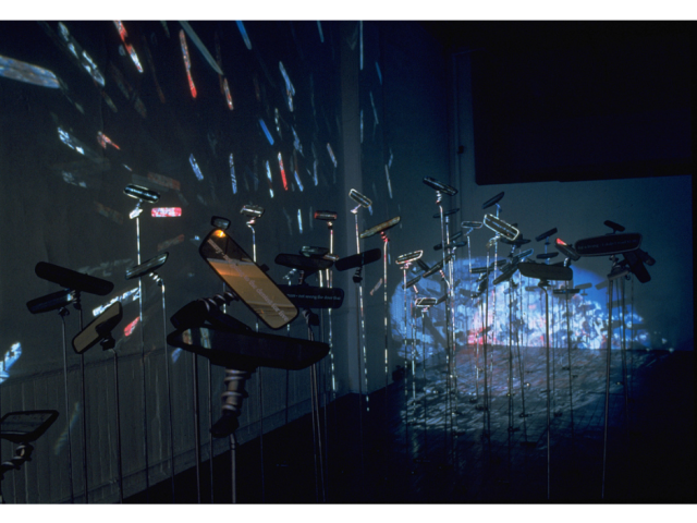 Jane Mulfinger Installation: Regrets Gallery Installations 1995 - 1997 [above: Franklin Furnace, N.Y.] Etched car rear-view mirrors, aluminum rod, slide projection