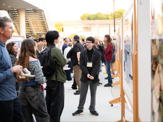 CCS presenter gives a poster presentation